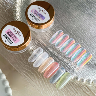 Cre8tion Opalite and Glaze Plus jars beside a row of glassy pastel nail tips on a textured glass plate