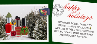 Holiday-themed polish bottles with a Christmas card on a snowy background