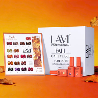 Lavi Fall cat eye kit box beside its swatch card and orange bottles on an orange set with autumn leaves