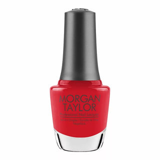Red nail polish bottle with black cap on a white background