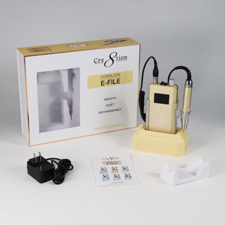 Light yellow Cre8tion cordless e-file in its window box with charger, bits and a white cradle