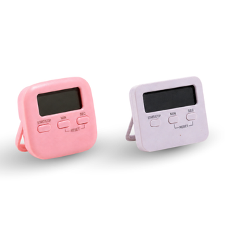 Two Cre8tion digital salon timers with square displays and fold out stands, one pink and one white.